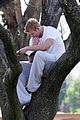 kellan lutz climbs tree reads book 04