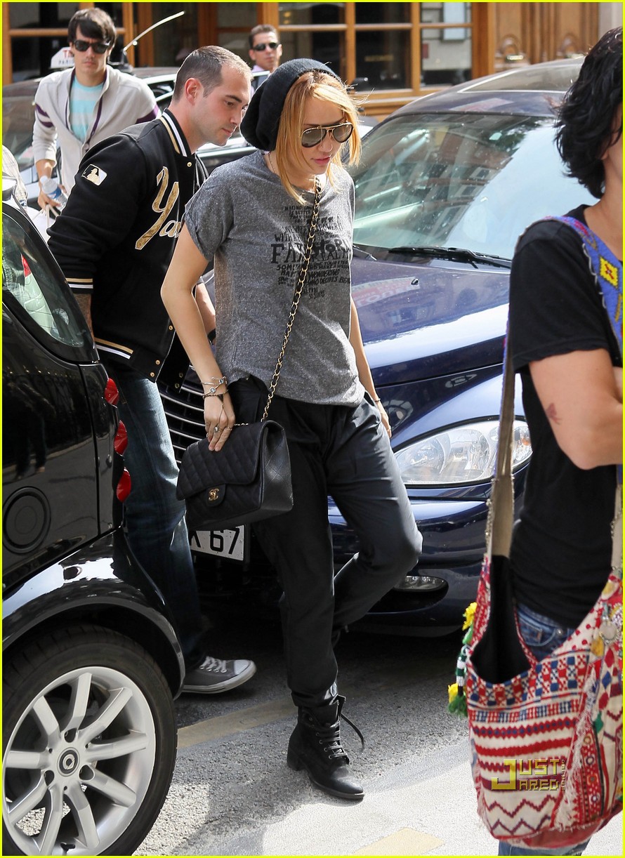 Miley Cyrus is seen leaving a pilates studio after her daily workout. 19  year old Miley wore a silver cardigan, white top, figure flattering blue  skinny jeans, dark sunglasses and carried a