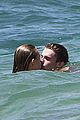 patrick schwarzenegger taylor burns kissing beach couple 03