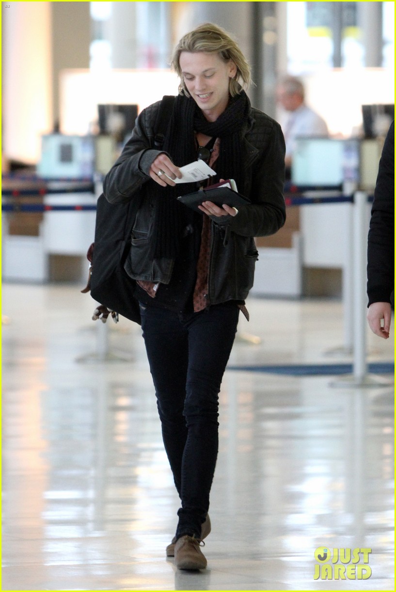 lily collins jcb separate toronto departures 03