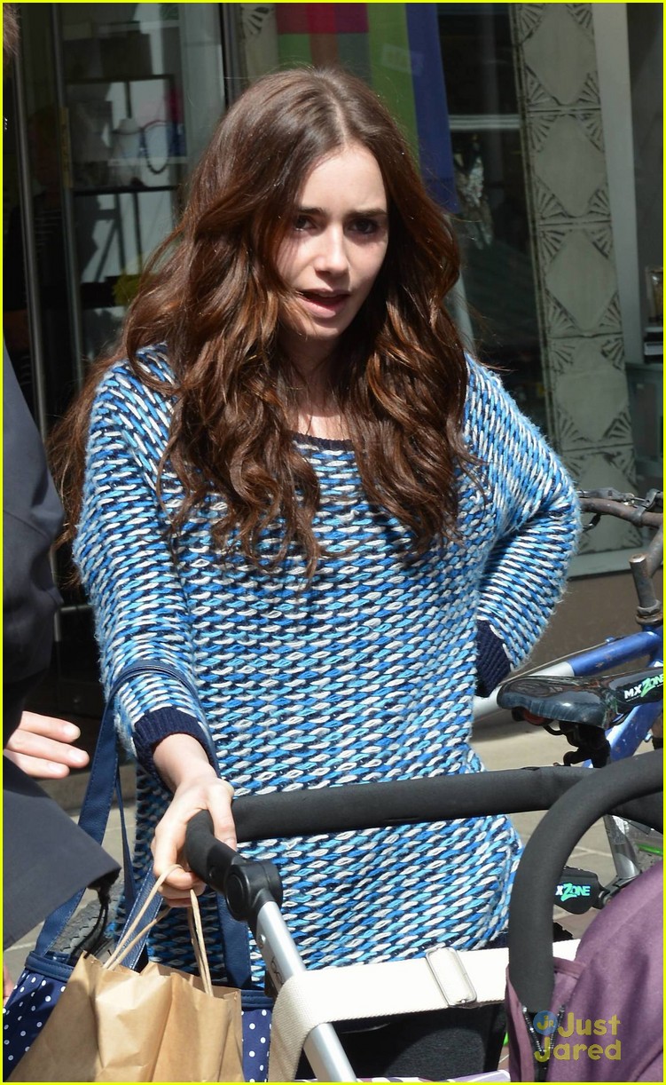 lily collins pushes stroller on love rosie set 02