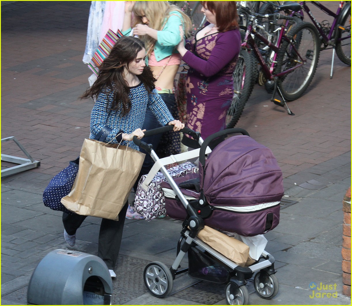 lily collins pushes stroller on love rosie set 05