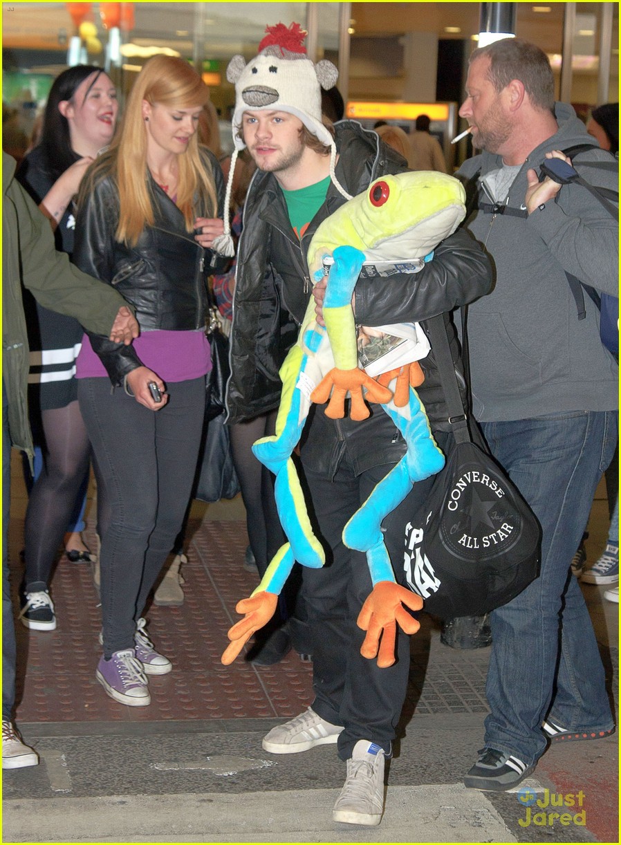 the wanted jay mcguiness carries froggy friend at the airport 01