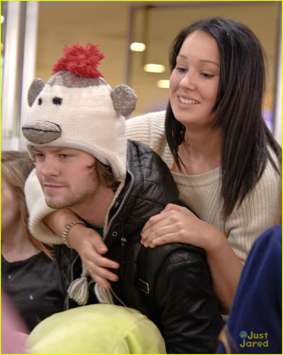 the wanted jay mcguiness carries froggy friend at the airport 05