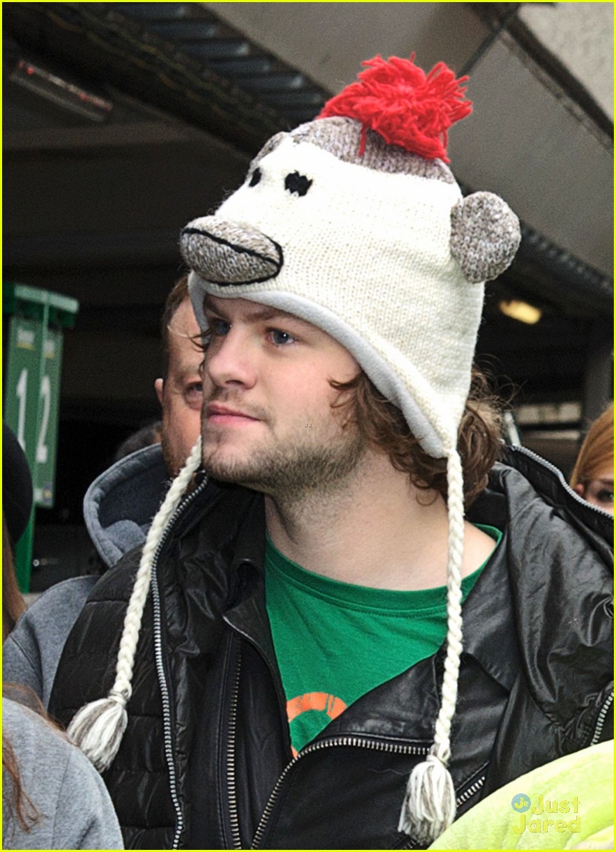the wanted jay mcguiness carries froggy friend at the airport 06