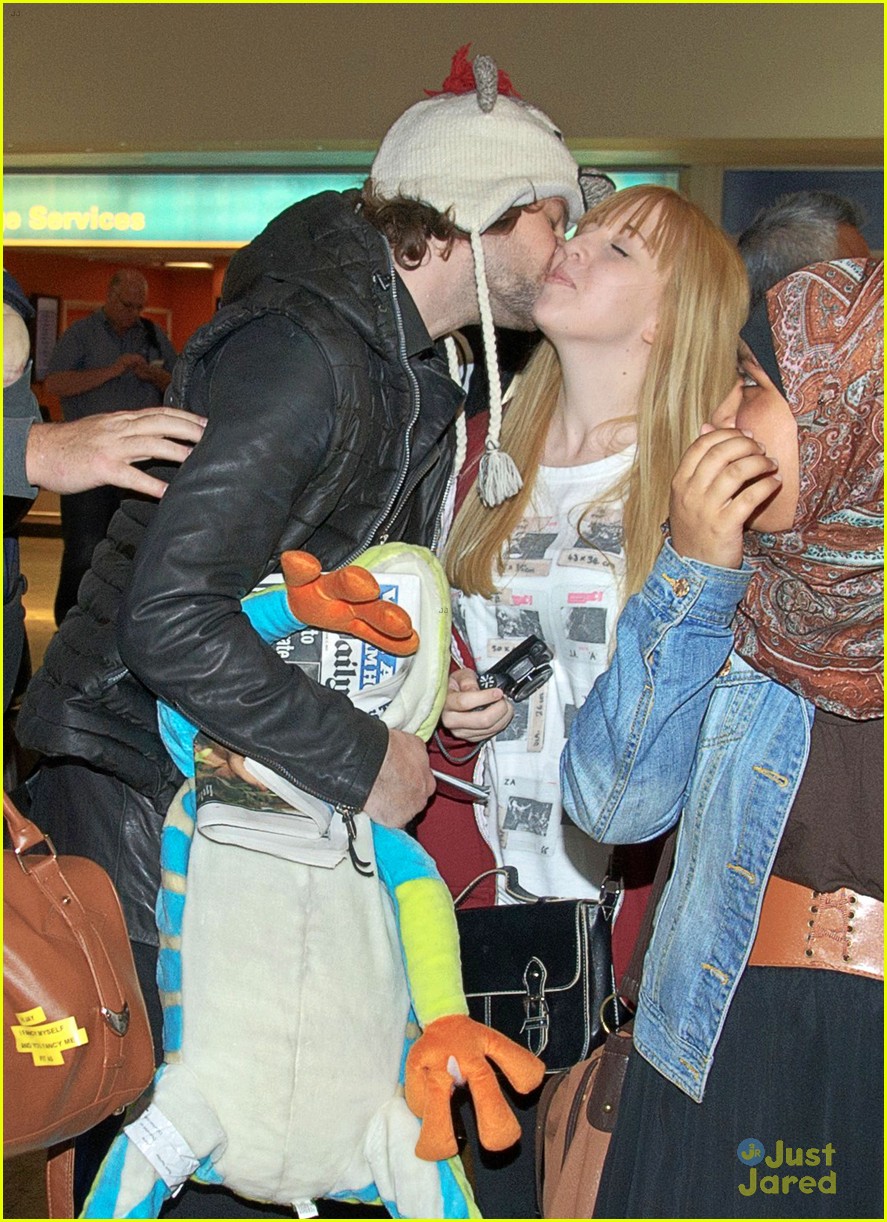 the wanted jay mcguiness carries froggy friend at the airport 08