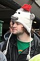 the wanted jay mcguiness carries froggy friend at the airport 06