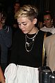 miley cyrus holds hands with nicole schzeringer london 05