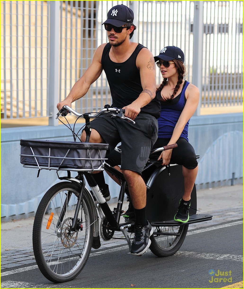taylor lautner marie avgeropoulos bicycle 03