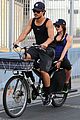 taylor lautner marie avgeropoulos bicycle 03