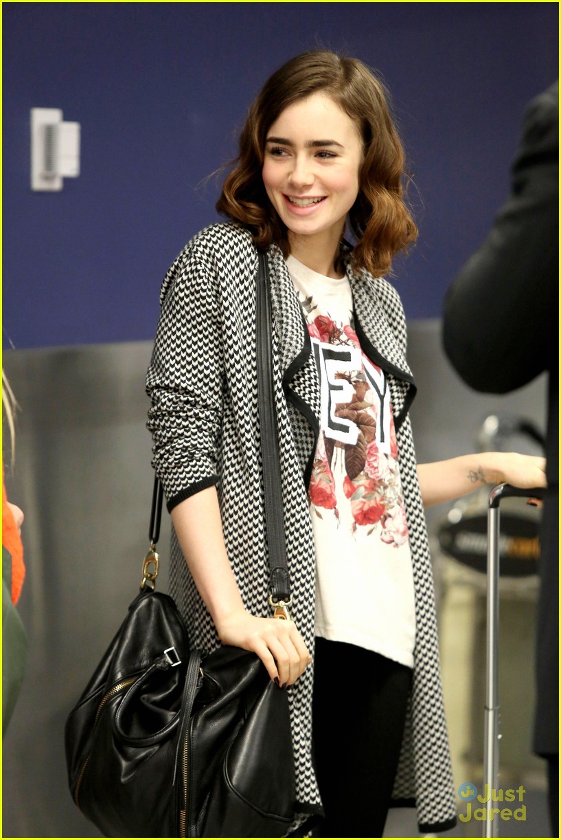 lily collins lax arrival hug 03