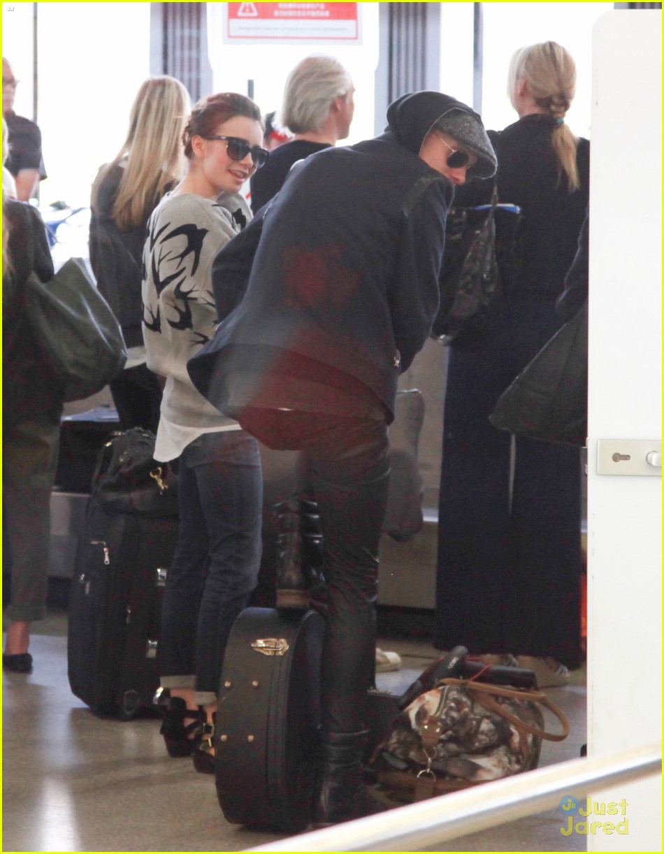 lily collins jamie campbell bower arrive in berlin 37