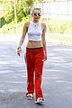 miley cyrus tongue out red pants 05