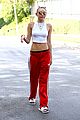 miley cyrus tongue out red pants 12