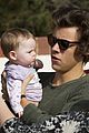 harry styles holds adorable baby fan in australia 11