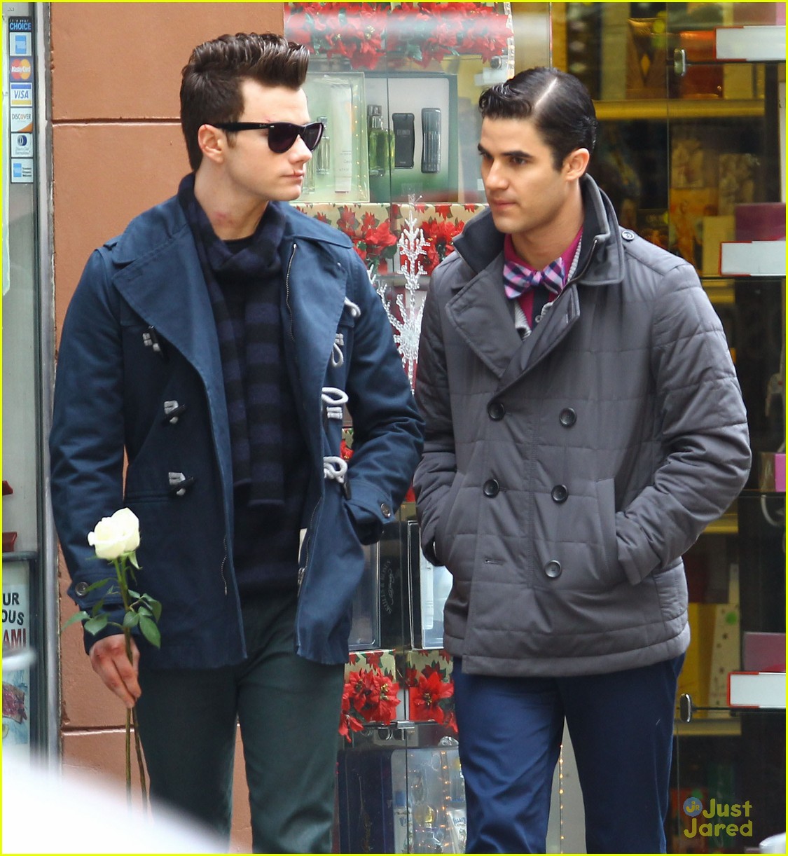 darren criss leans on chris colfer while filming glee 09