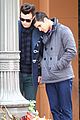 darren criss leans on chris colfer while filming glee 14