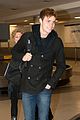 spencer sutherland hits lax airport after vampire academy premiere 04
