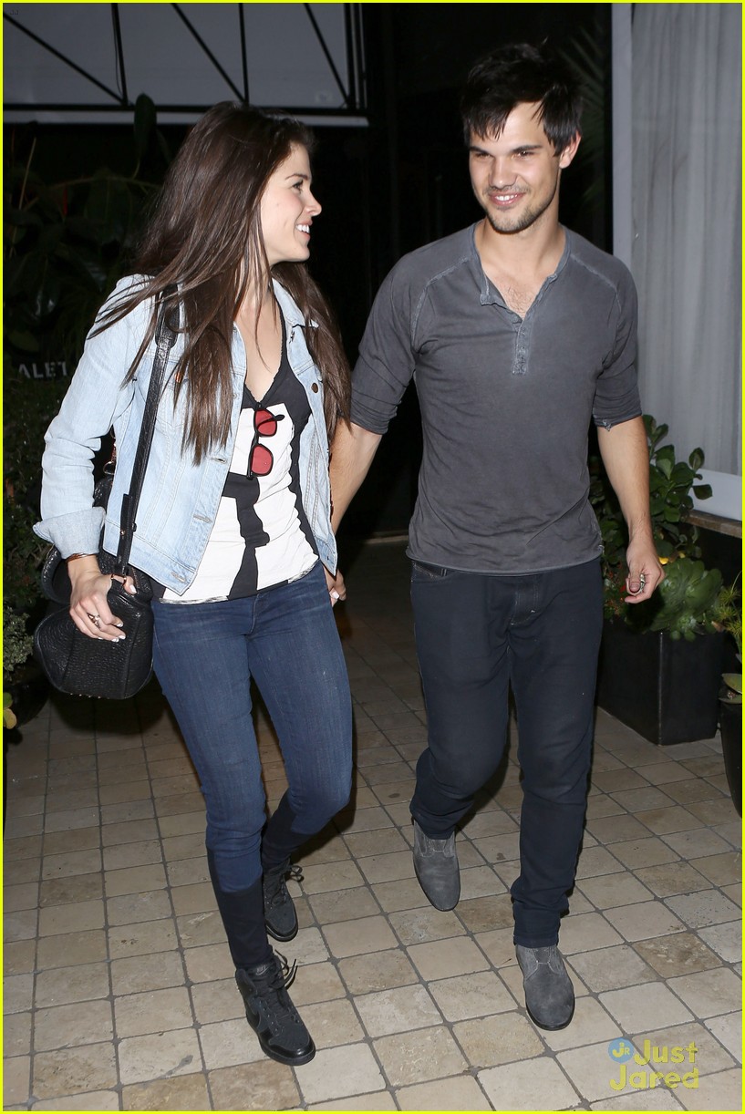 taylor lautner marie avgeropoulos hold hands 03