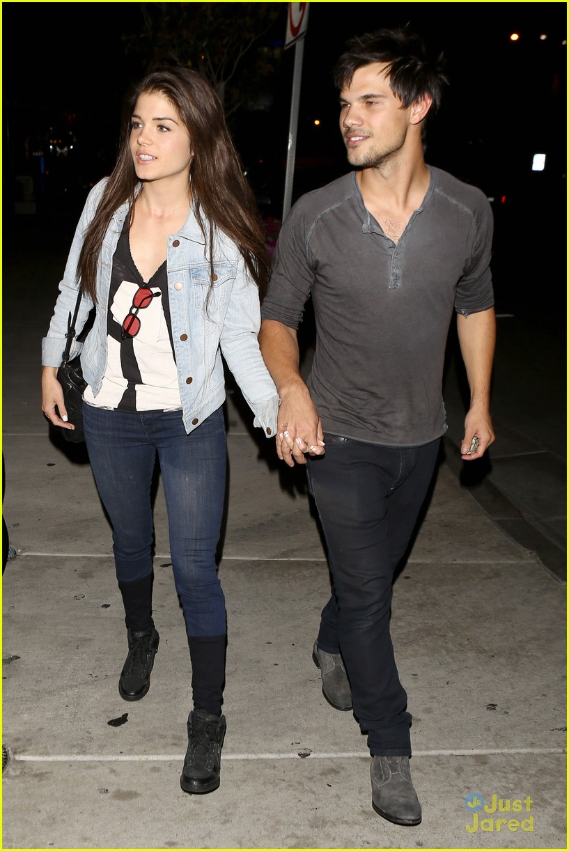 taylor lautner marie avgeropoulos hold hands 09