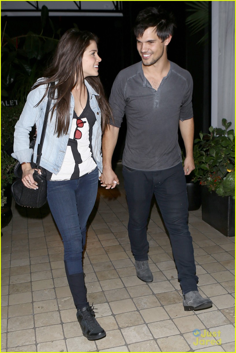 taylor lautner marie avgeropoulos hold hands 14