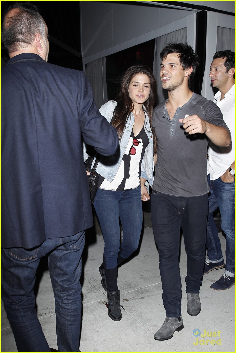 taylor lautner marie avgeropoulos hold hands 17