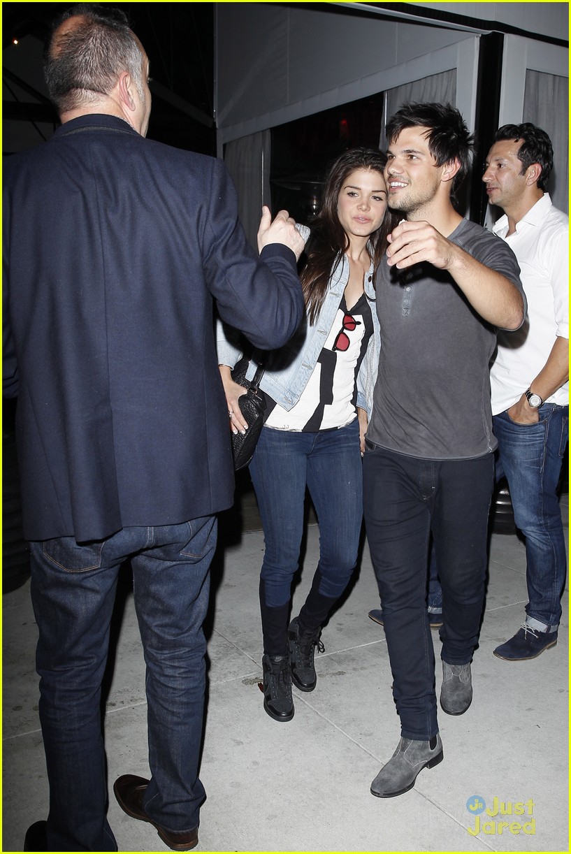 taylor lautner marie avgeropoulos hold hands 18