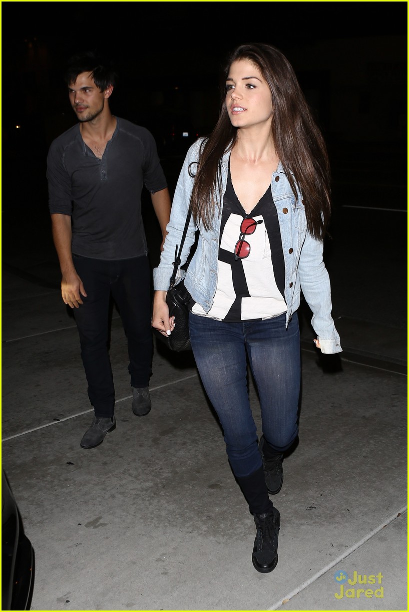 taylor lautner marie avgeropoulos hold hands 22