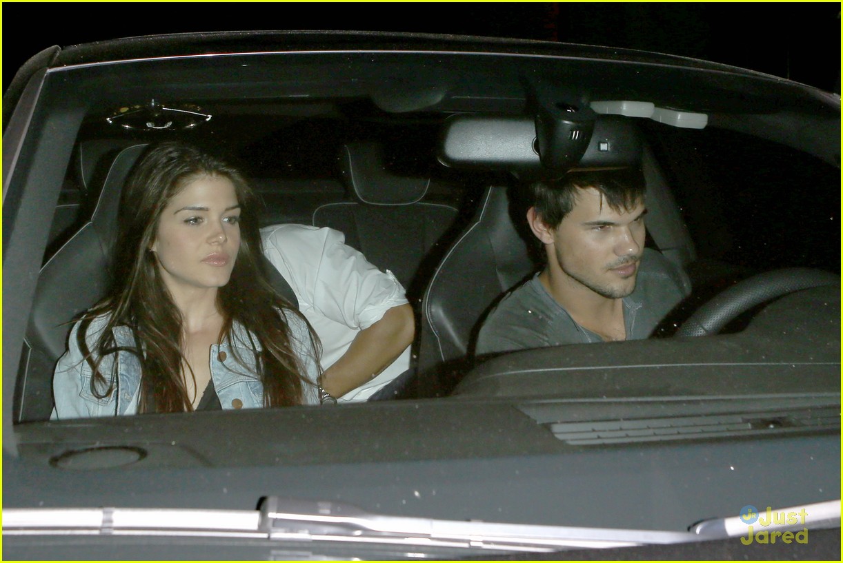 taylor lautner marie avgeropoulos hold hands 23
