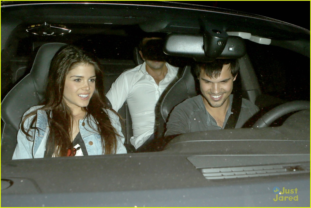 taylor lautner marie avgeropoulos hold hands 24