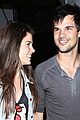 taylor lautner marie avgeropoulos hold hands 02