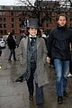daniel radcliffe covers long hair with topper hat 03