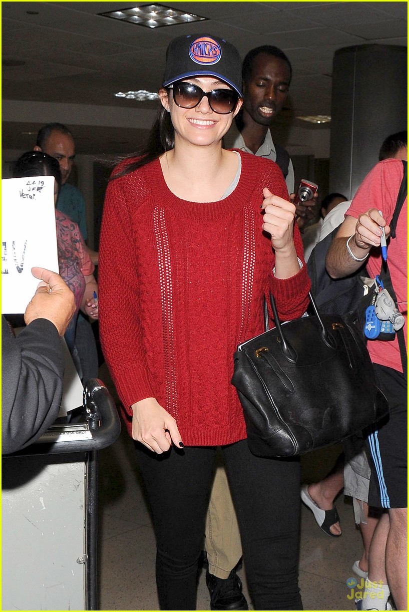 emmy rossum flashes a smile at lax airport 11