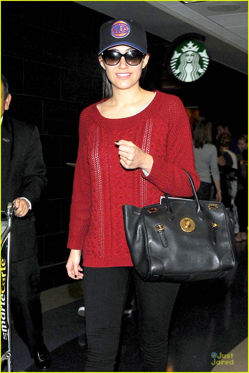 emmy rossum flashes a smile at lax airport 12