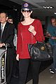 emmy rossum flashes a smile at lax airport 02