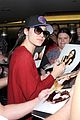 emmy rossum flashes a smile at lax airport 06