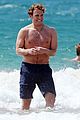 sam claflin shirtless at the beach 22