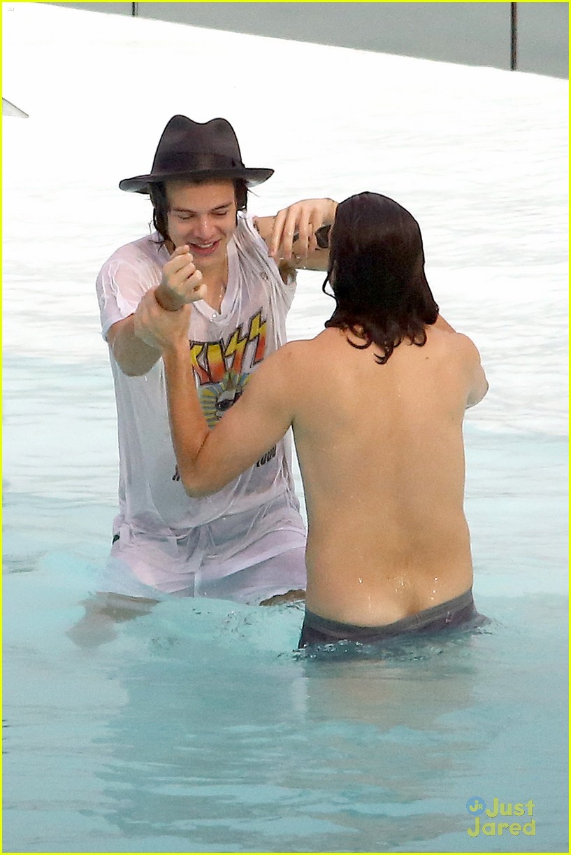 harry styles shirtless rio tossed in pool 19