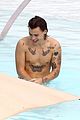 harry styles shirtless rio tossed in pool 04