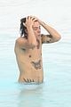 harry styles shirtless rio tossed in pool 06