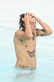 harry styles shirtless rio tossed in pool 14