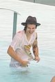 harry styles shirtless rio tossed in pool 17