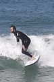 liam hemsworth surfs the waves with his brother luke01