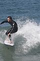 liam hemsworth surfs the waves with his brother luke04