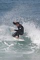 liam hemsworth surfs the waves with his brother luke05