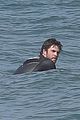 liam hemsworth surfs the waves with his brother luke07