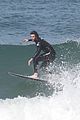 liam hemsworth surfs the waves with his brother luke13