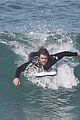 liam hemsworth surfs the waves with his brother luke14