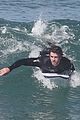 liam hemsworth surfs the waves with his brother luke18