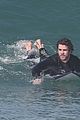 liam hemsworth surfs the waves with his brother luke19